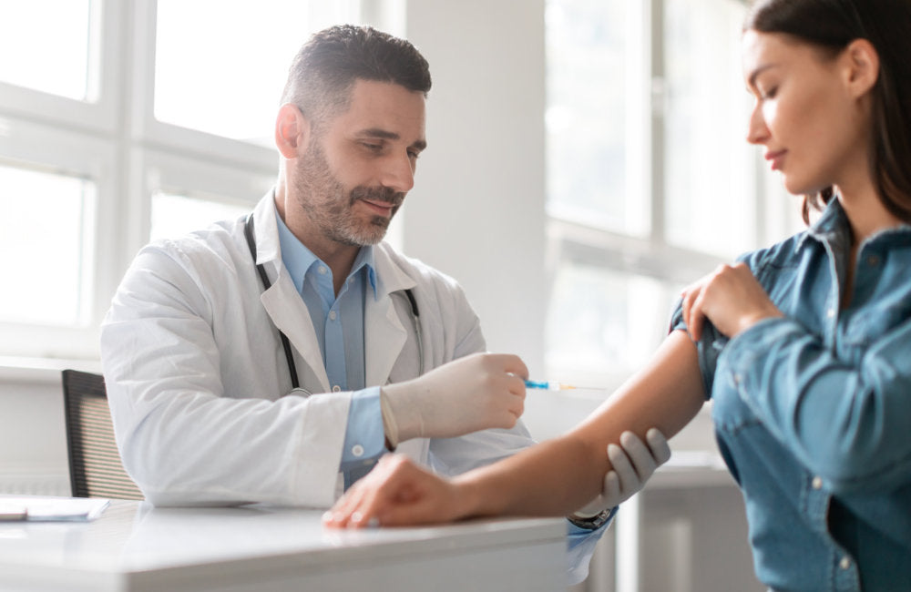 a woman getting a vaccine