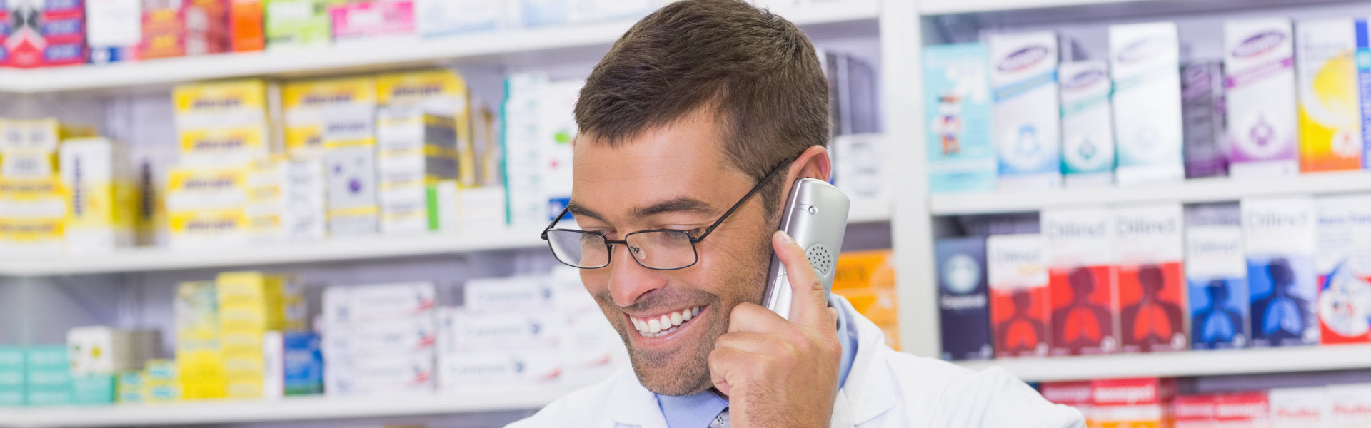 pharmacist holding cellphone